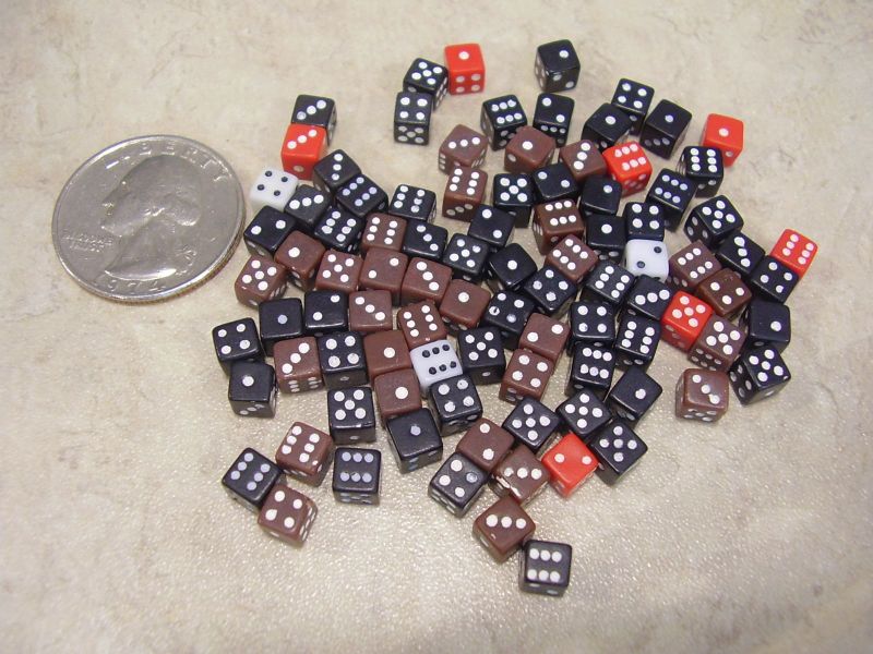 tiny tiny dice ganging up to fight a quarter